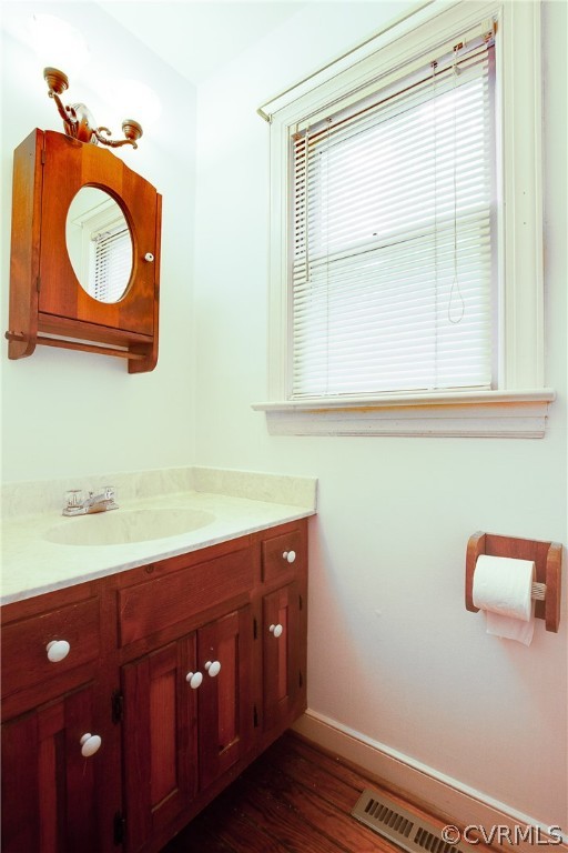 8403 Spring Meadow Road Richmond, VA 23235 - Photo 7 of 19 a bathroom with a sink a light fixture and a vanity