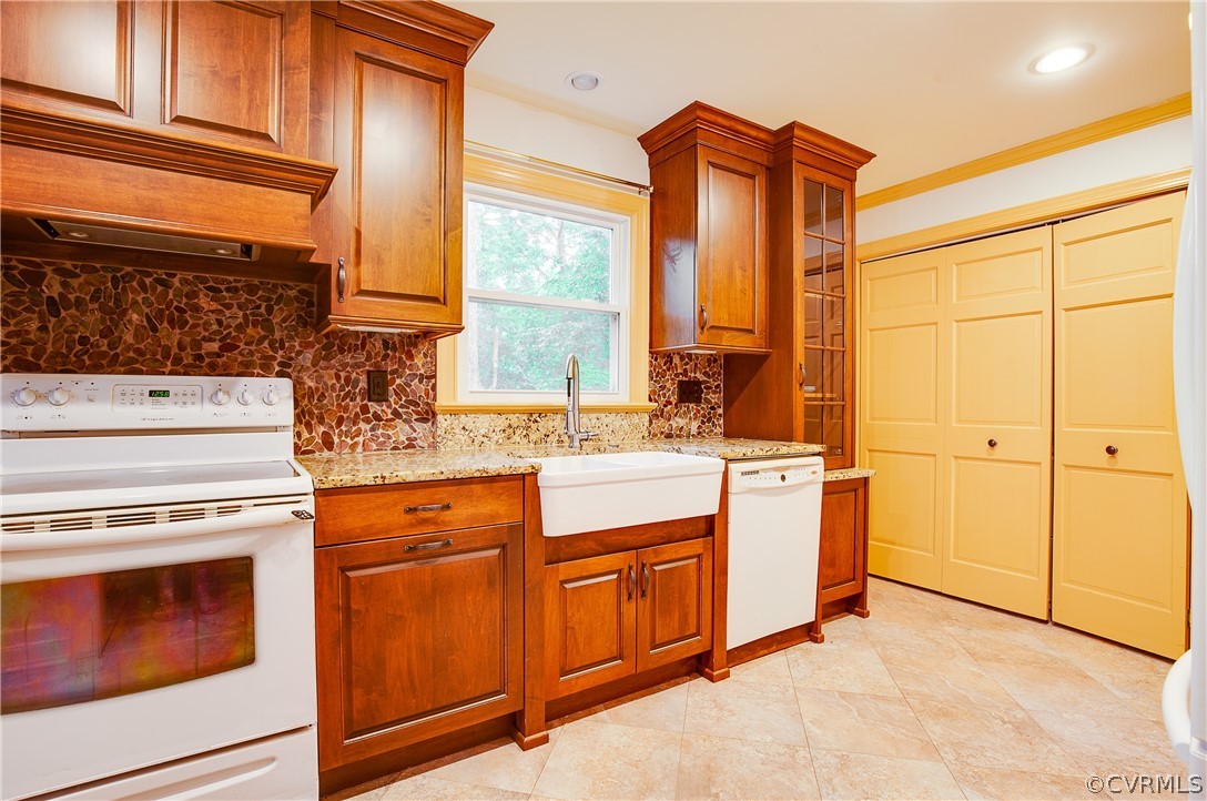 8403 Spring Meadow Road Richmond, VA 23235 - Photo 9 of 19 a kitchen with stainless steel appliances a stove sink and cabinets