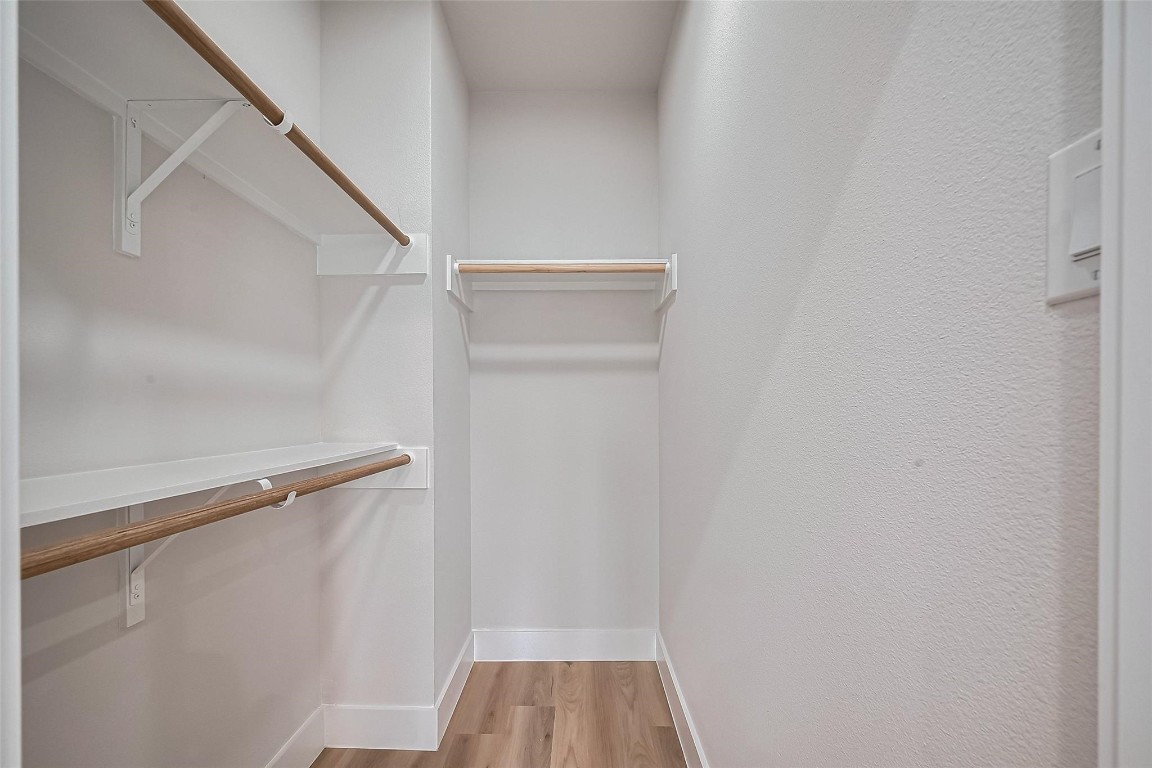 3542 Mt Pleasant Street Houston, TX 77021 - Photo 11 of 17 a view of walk in closet with empty racks