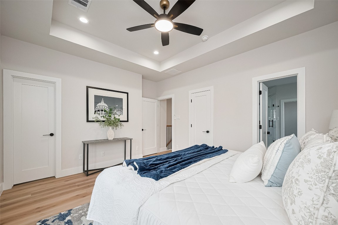 3542 Mt Pleasant Street Houston, TX 77021 - Photo 7 of 17 a bedroom with a large bed and a chandelier