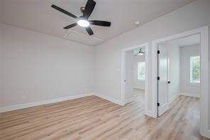 3542 Mt Pleasant Street Houston, TX 77021 - Photo 10 of 17 an empty room with wooden floor and a ceiling fan