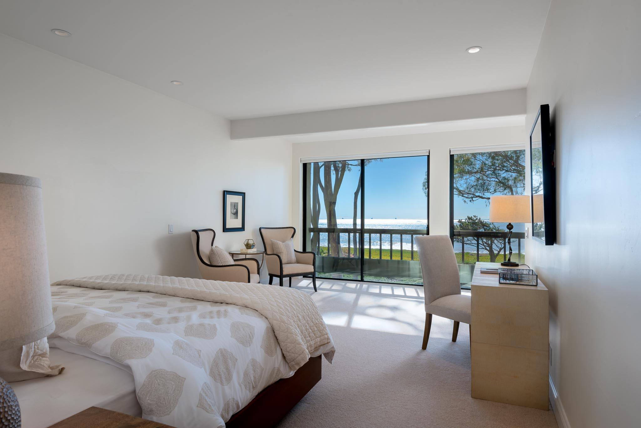 26 Seaview Drive Santa Barbara, CA 93108 - Photo 11 of 26 a bedroom with a bed and large windows