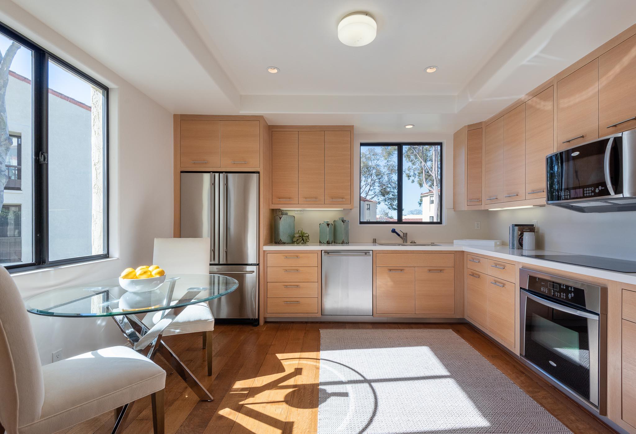 26 Seaview Drive Santa Barbara, CA 93108 - Photo 5 of 26 a kitchen with a sink chairs and refrigerator