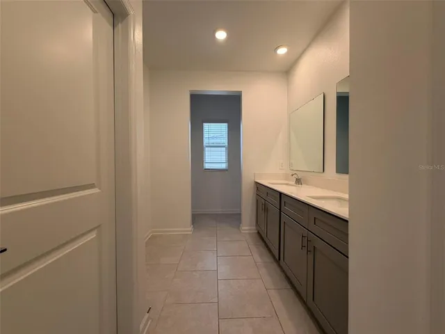 a bathroom with a glass shower door