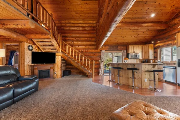 a view of a livingroom with furniture and a fireplace