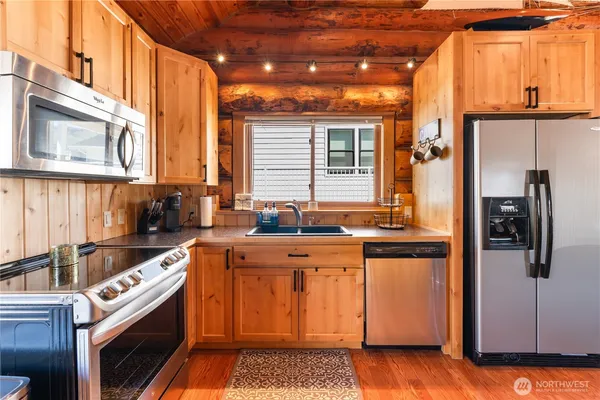 a kitchen that has a sink and a stove