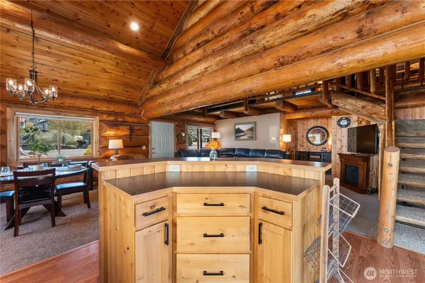 a kitchen with stainless steel appliances granite countertop a sink and a stove
