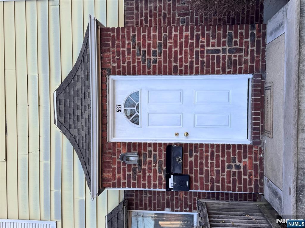 a front view of a house with a glass door