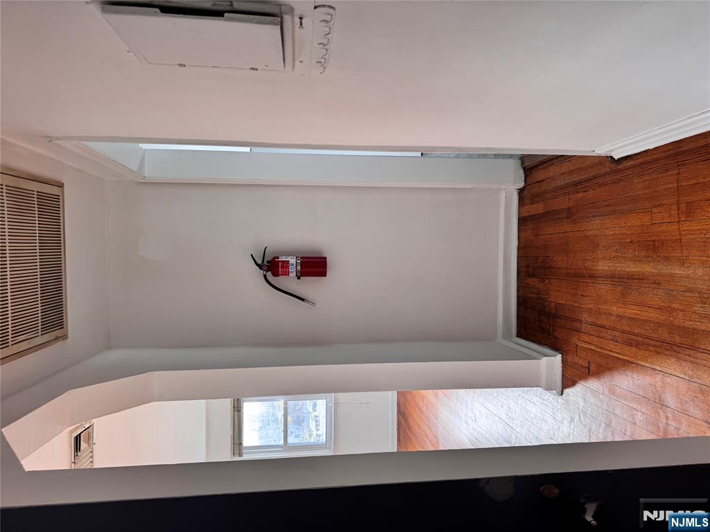 567 Boulevard, Unit 2 Hasbrouck Heights, NJ 07604 - Photo 4 of 7 a view of empty room with wooden floor