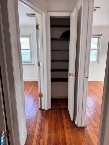 a view of front door with wooden floor