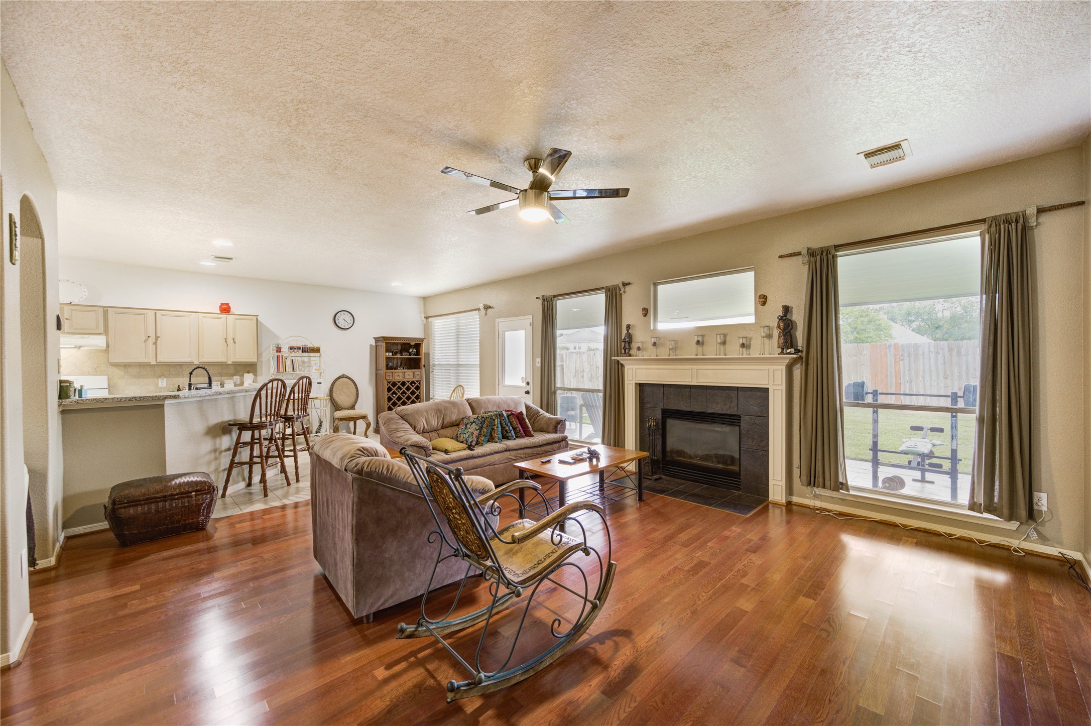 16730 Spring Barker Drive Cypress, TX 77429 - Photo 14 of 50 a living room with furniture a fireplace and wooden floor