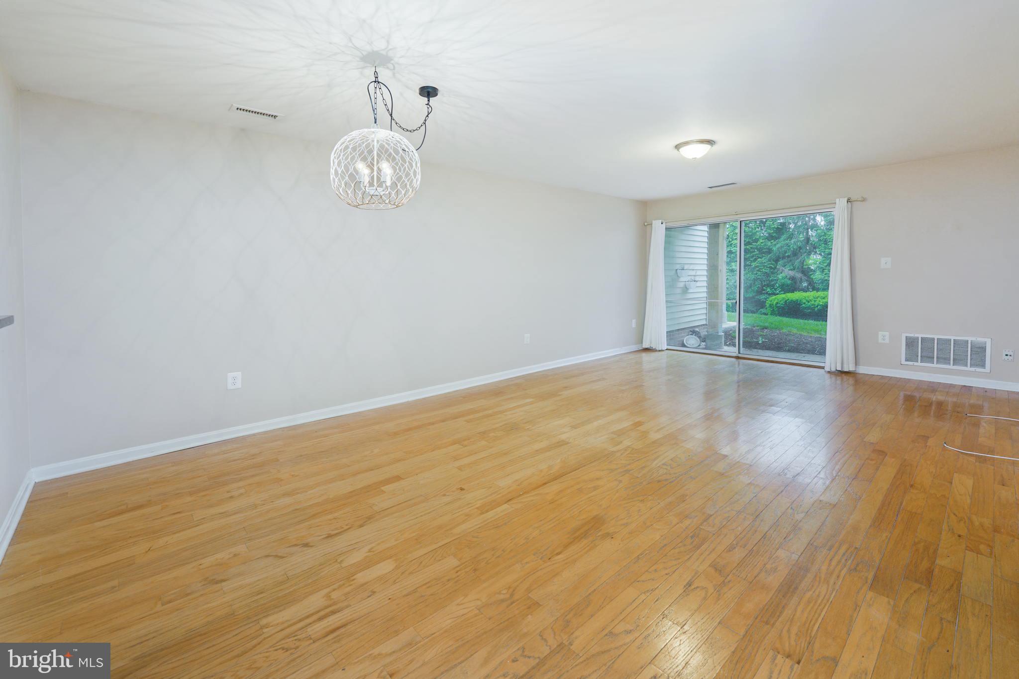 20578 Snowshoe Square, Unit 101 Ashburn, VA 20147 - Photo 5 of 13 Spacious Living room and ding room