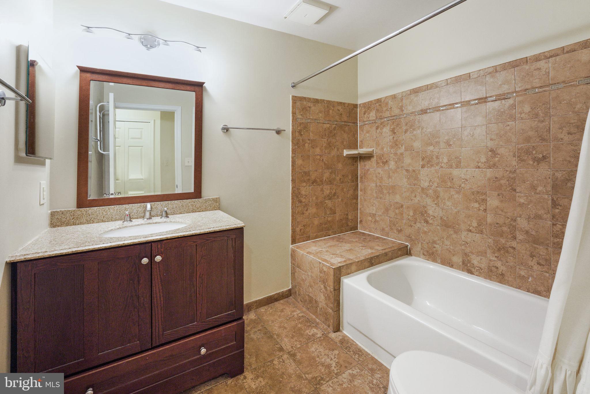 20578 Snowshoe Square, Unit 101 Ashburn, VA 20147 - Photo 9 of 13 Updated bath