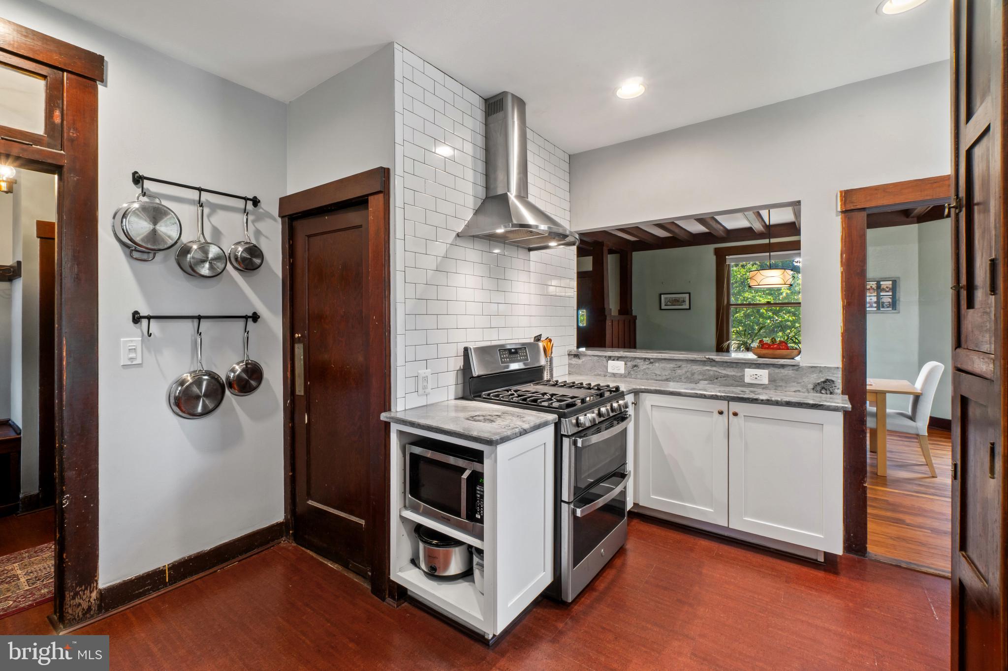 2900 Rueckert Avenue Baltimore, MD 21214 - Photo 15 of 40 a kitchen with stainless steel appliances granite countertop a stove and a refrigerator