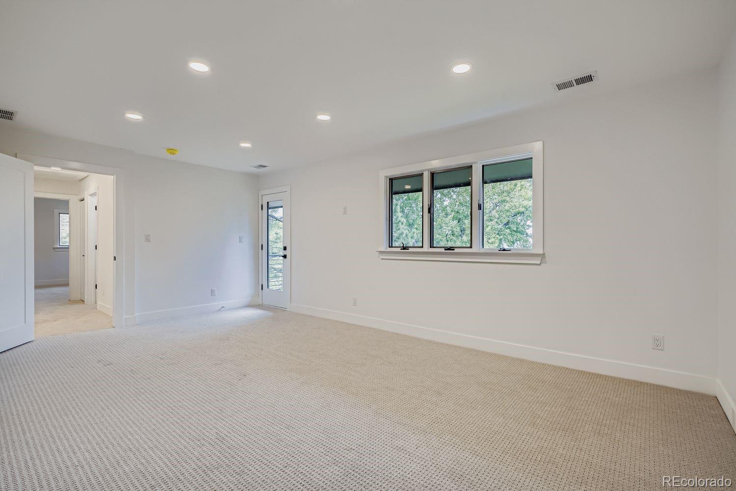 2127 Elderberry Road Golden, CO 80401 - Photo 17 of 43 an empty room with a window