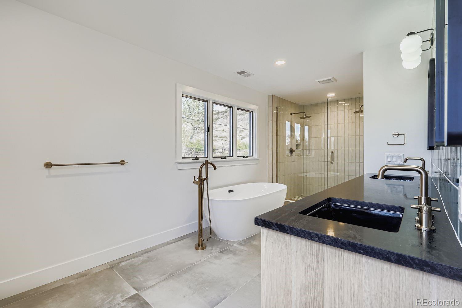 2127 Elderberry Road Golden, CO 80401 - Photo 20 of 43 a kitchen with a sink a stove and cabinets
