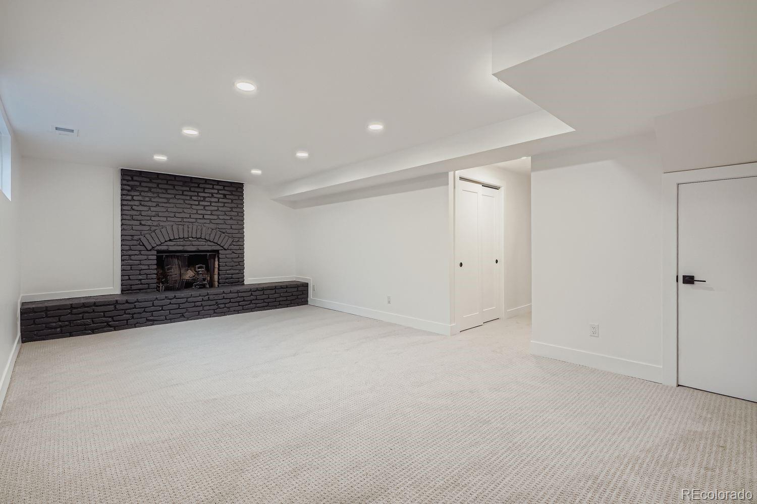 2127 Elderberry Road Golden, CO 80401 - Photo 26 of 43 a view of empty room with fireplace