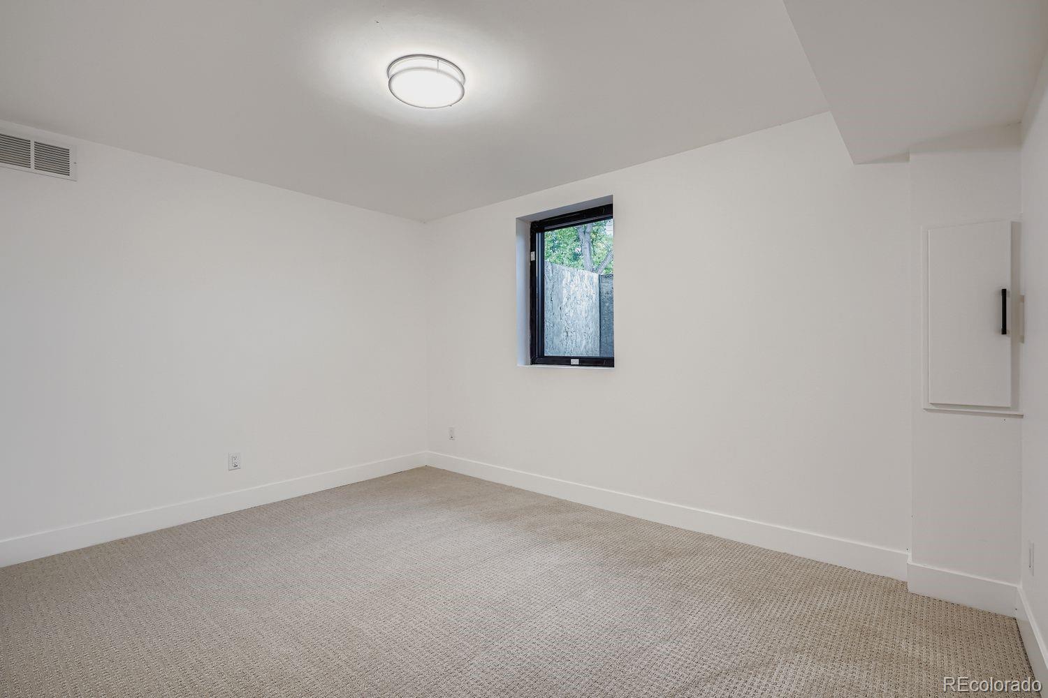 2127 Elderberry Road Golden, CO 80401 - Photo 27 of 43 an empty room with a window