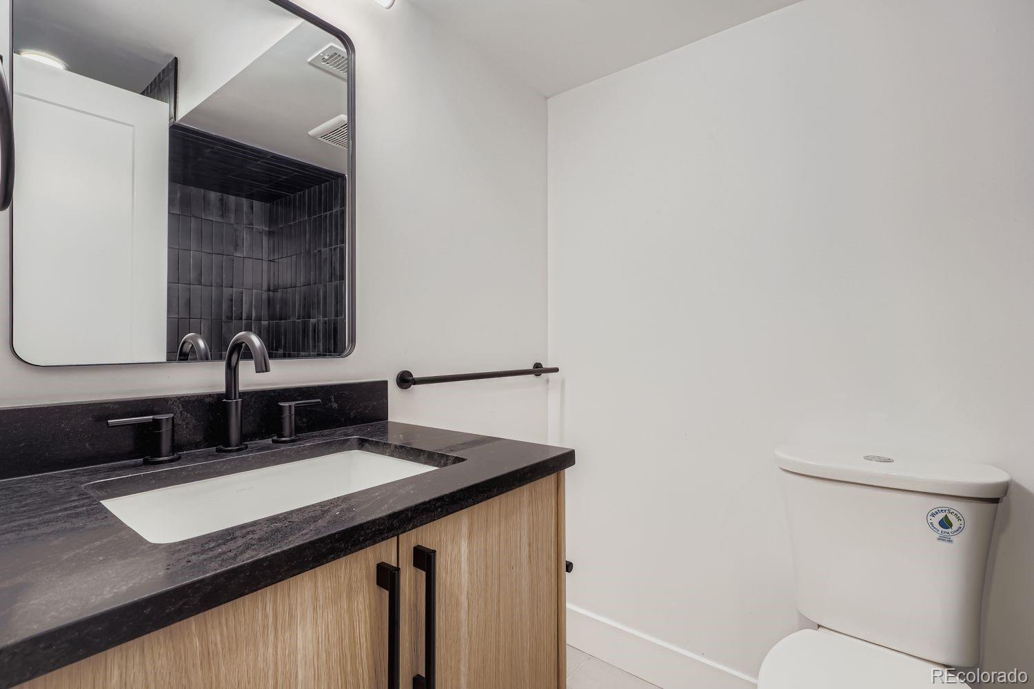 2127 Elderberry Road Golden, CO 80401 - Photo 28 of 43 a bathroom with a sink and a mirror