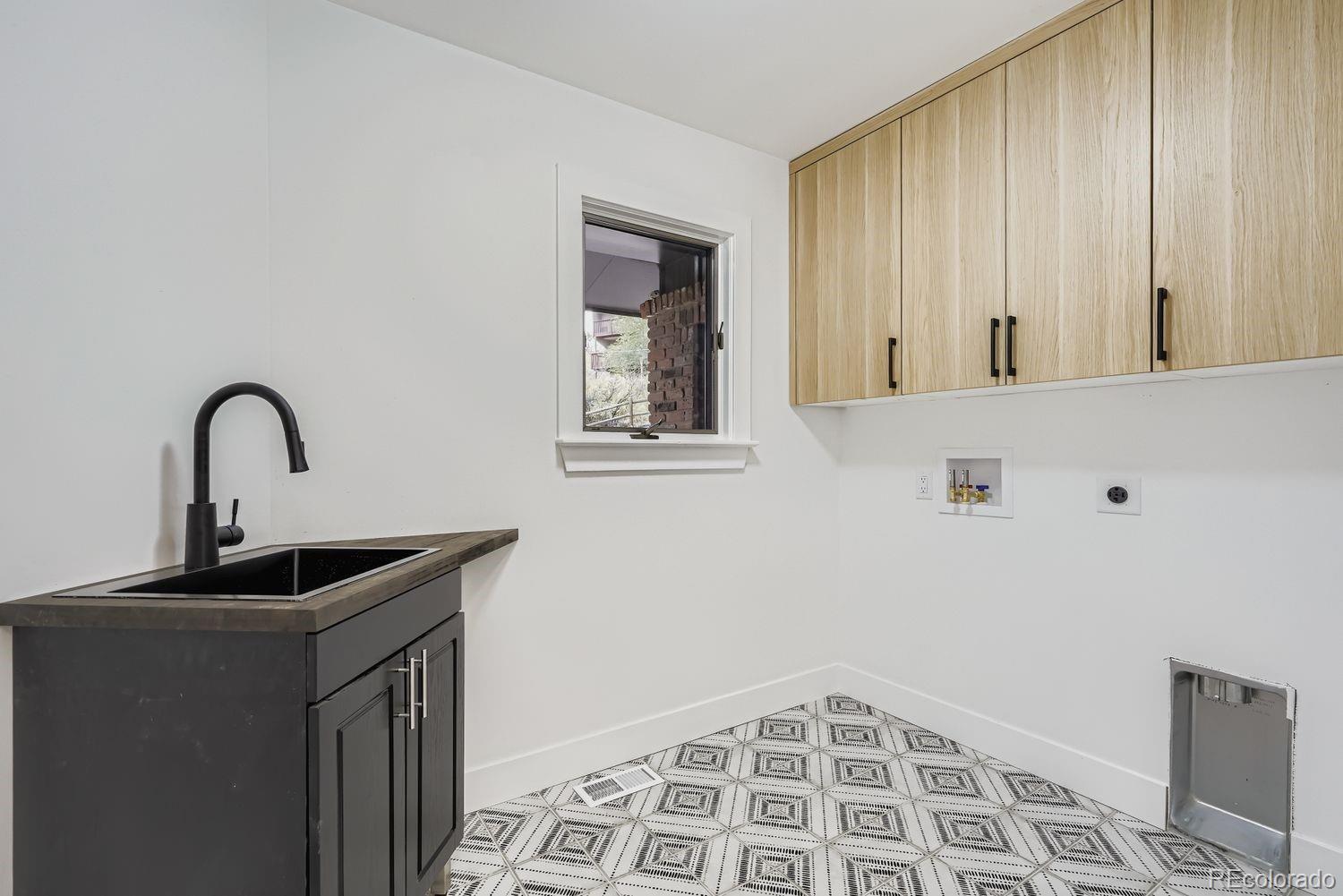 2127 Elderberry Road Golden, CO 80401 - Photo 29 of 43 a bathroom with a sink and a mirror