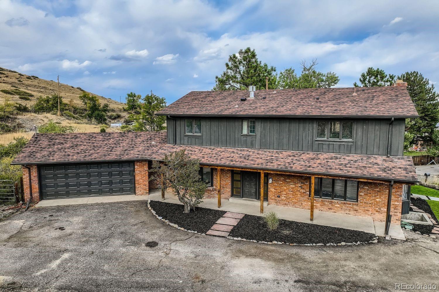 2127 Elderberry Road Golden, CO 80401 - Photo 38 of 43 a front view of a house with a garden