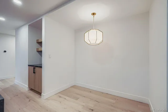 an empty room with a mirror