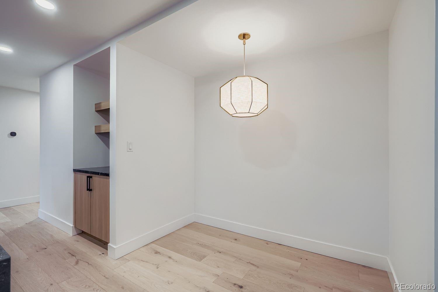 2127 Elderberry Road Golden, CO 80401 - Photo 10 of 43 an empty room with a mirror