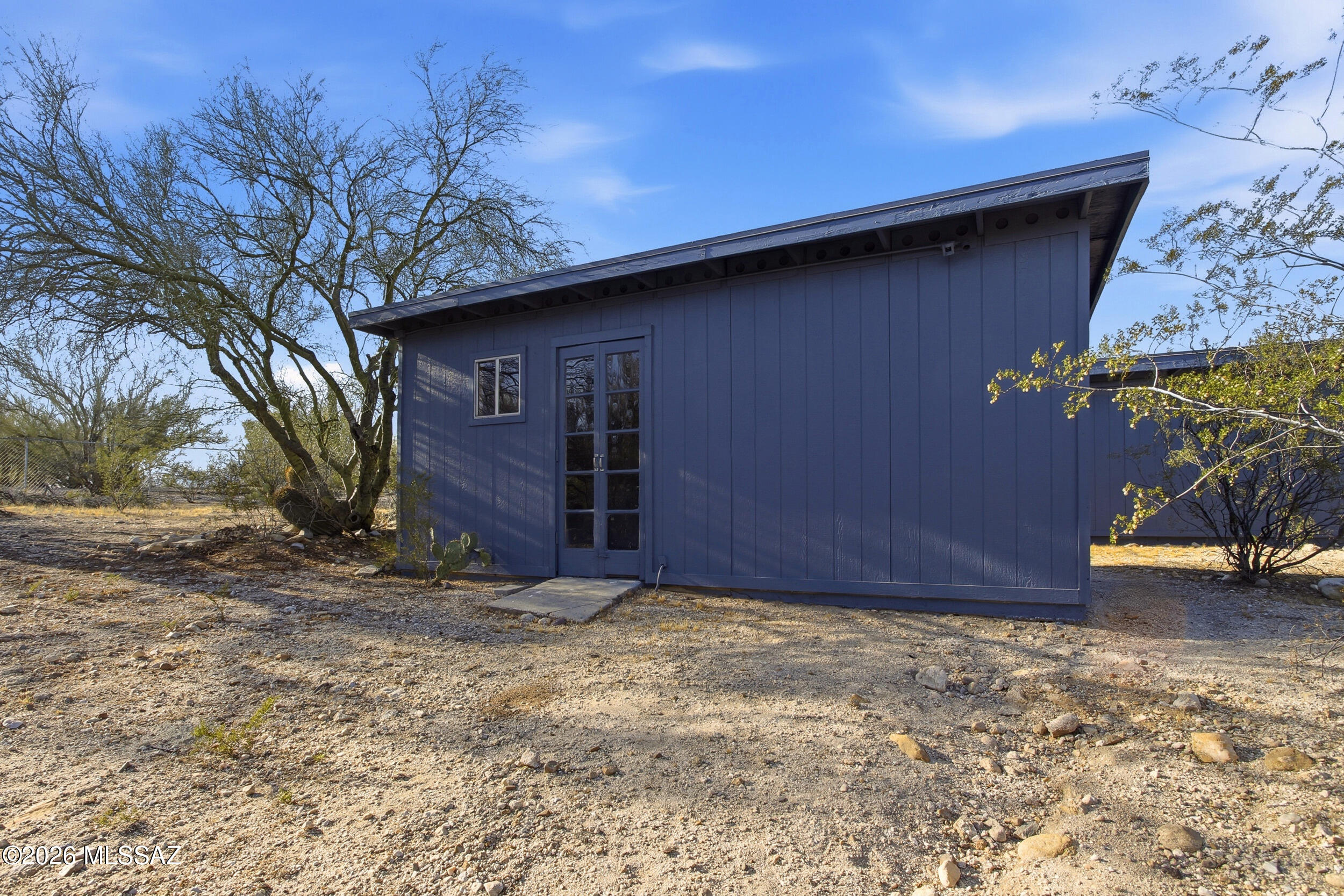 9141 East Indian Canyon Road Tucson, AZ 85749 - Photo 29 of 33 a view of a house with a tree