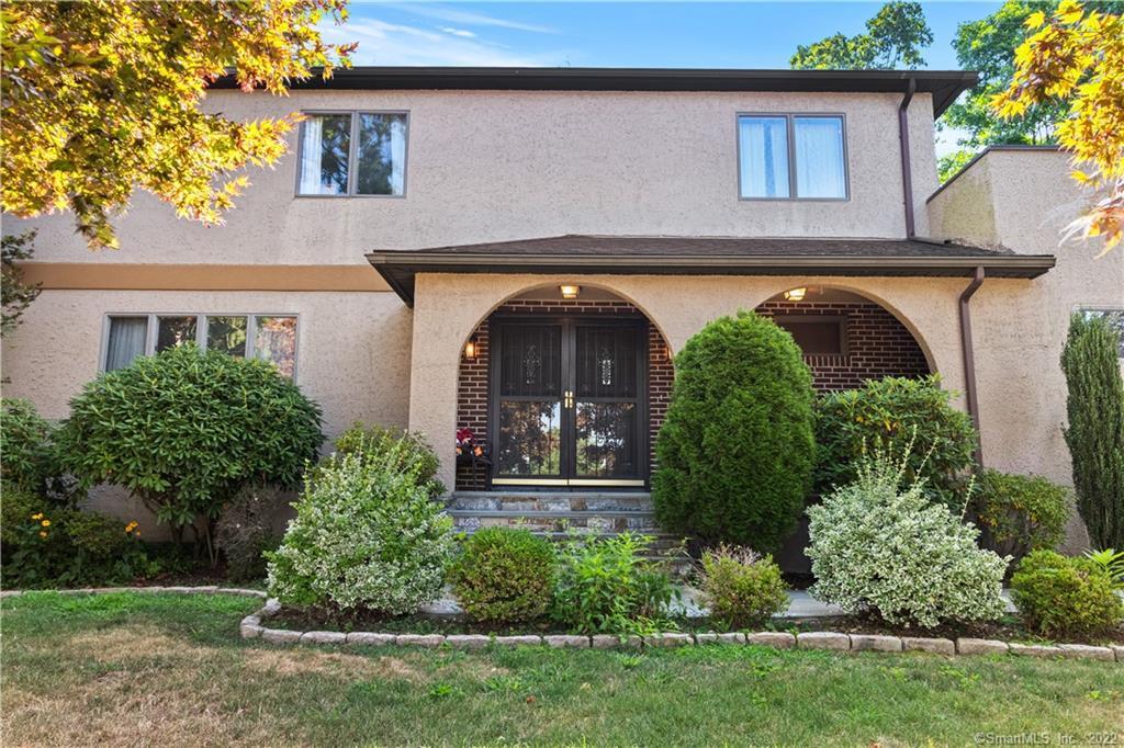 front view of house with a garden