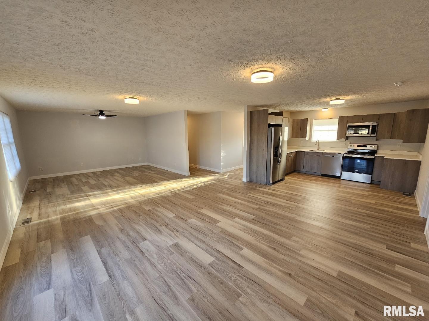 10457 Puckett Lane Mount Vernon, IL 62864 - Photo 12 of 25 a view of kitchen and hall with wooden floor