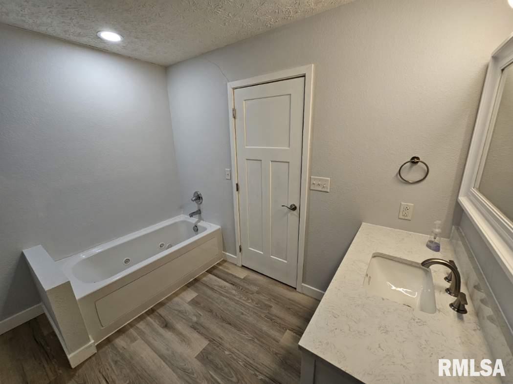10457 Puckett Lane Mount Vernon, IL 62864 - Photo 25 of 25 a bathroom with a sink and a tub
