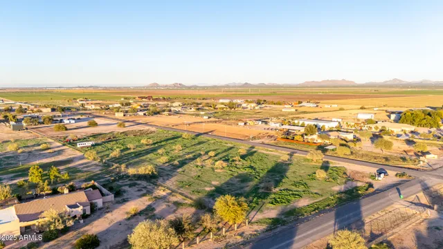 an aerial view of residential building and ocean view