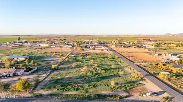 an aerial view of residential building and lake
