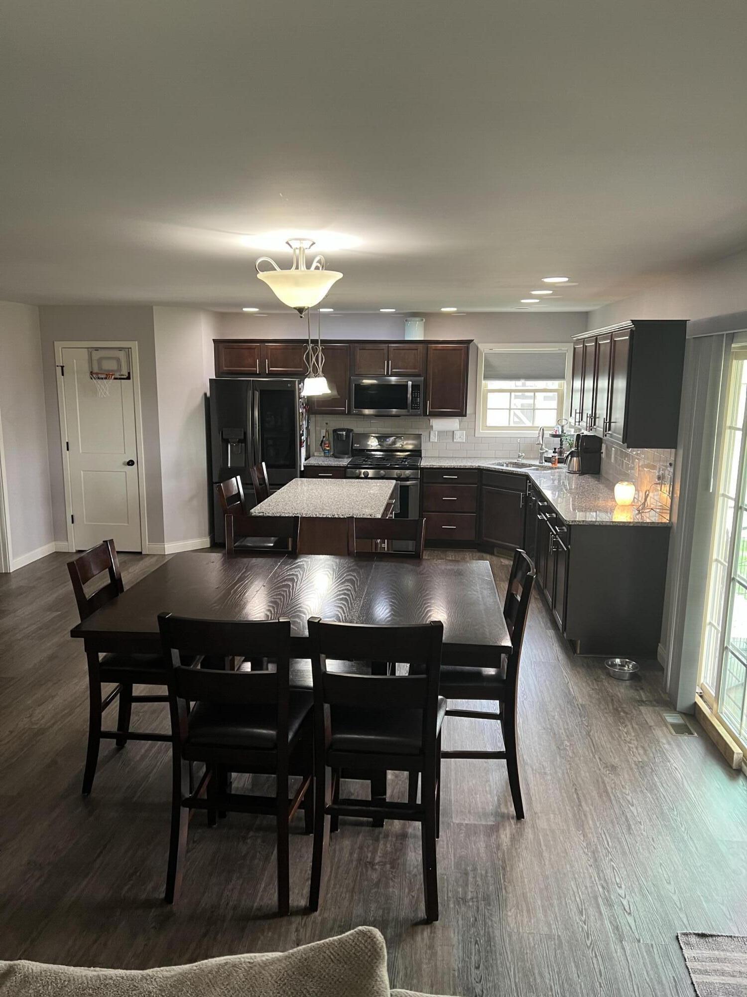 702 19th Street Southeast De Motte, IN 46310 - Photo 9 of 22 a dining room with furniture and wooden floor