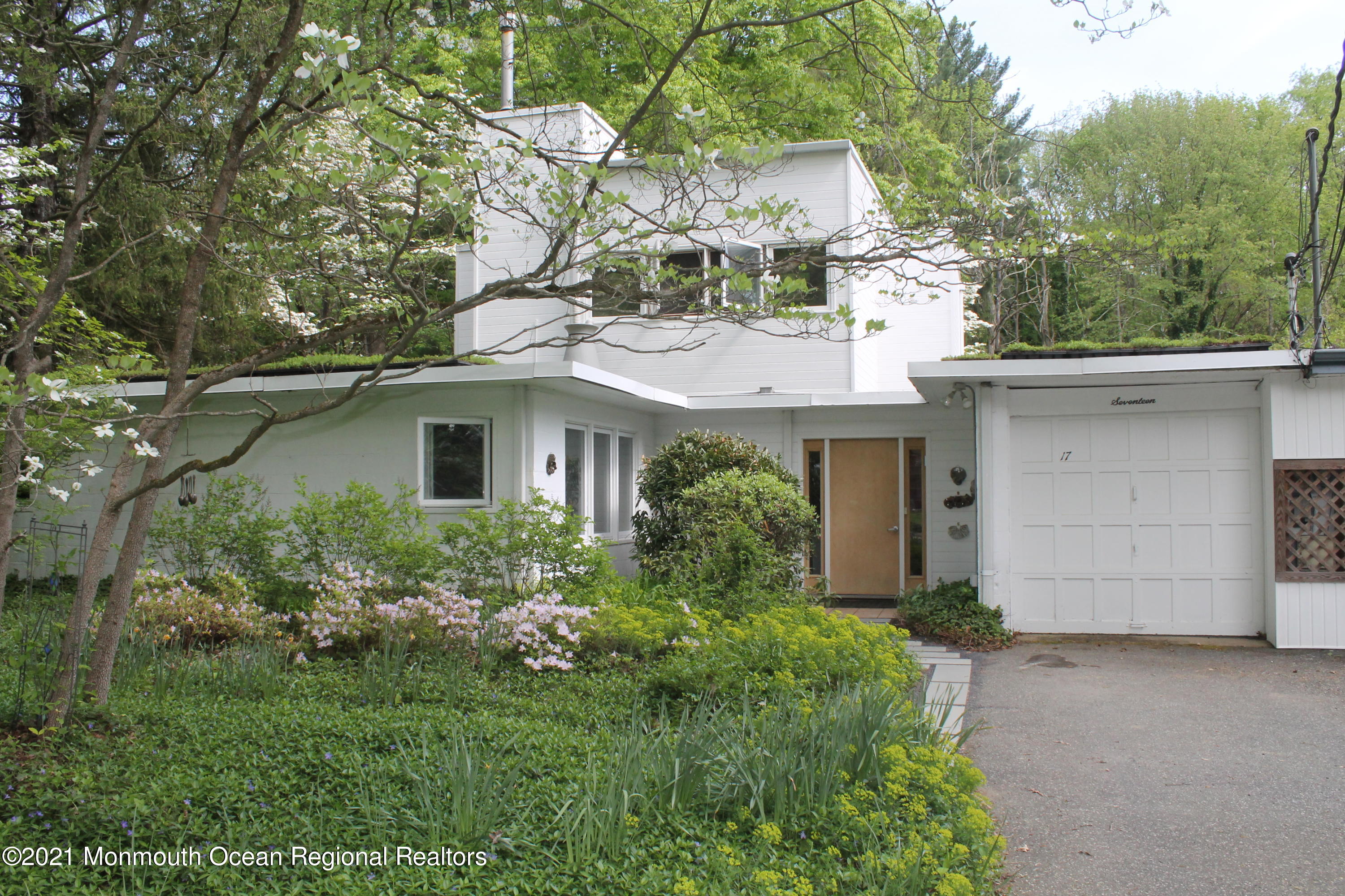 front view of a house with a garden