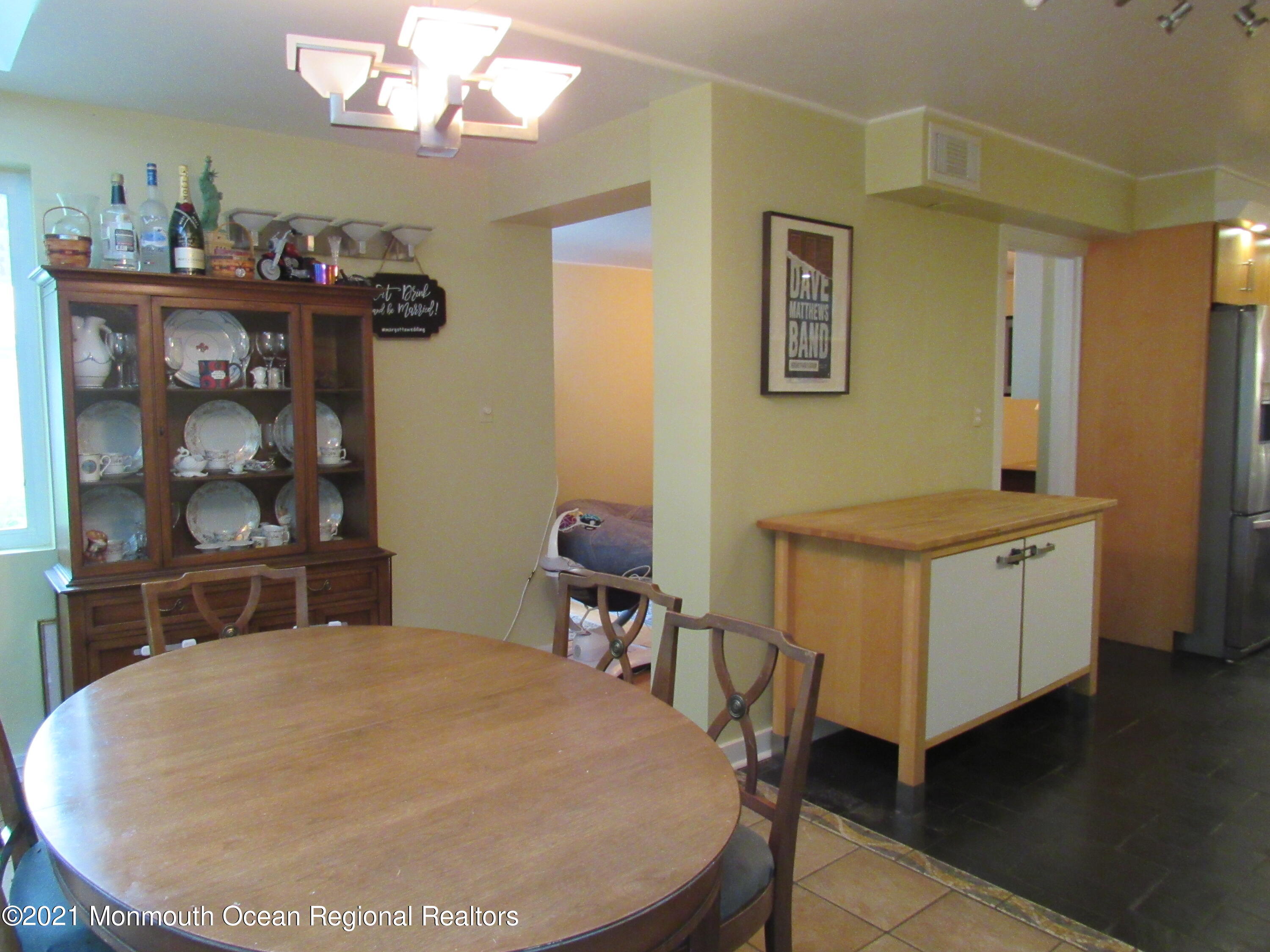 17 Pine Drive Roosevelt, NJ 08555 - Photo 11 of 22 a room with a bed and a table in it