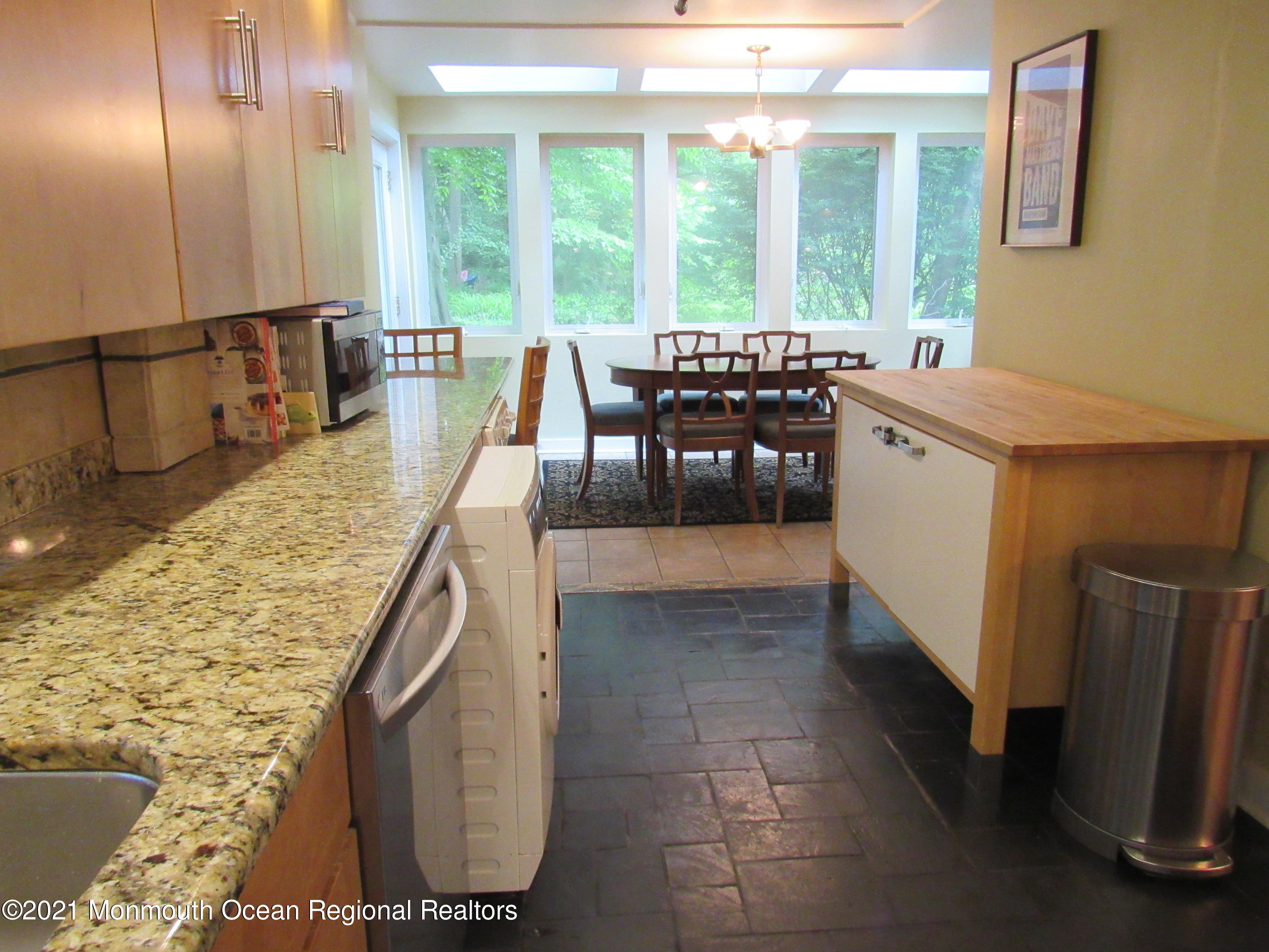 17 Pine Drive Roosevelt, NJ 08555 - Photo 14 of 22 a dining room with furniture and a floor to ceiling window