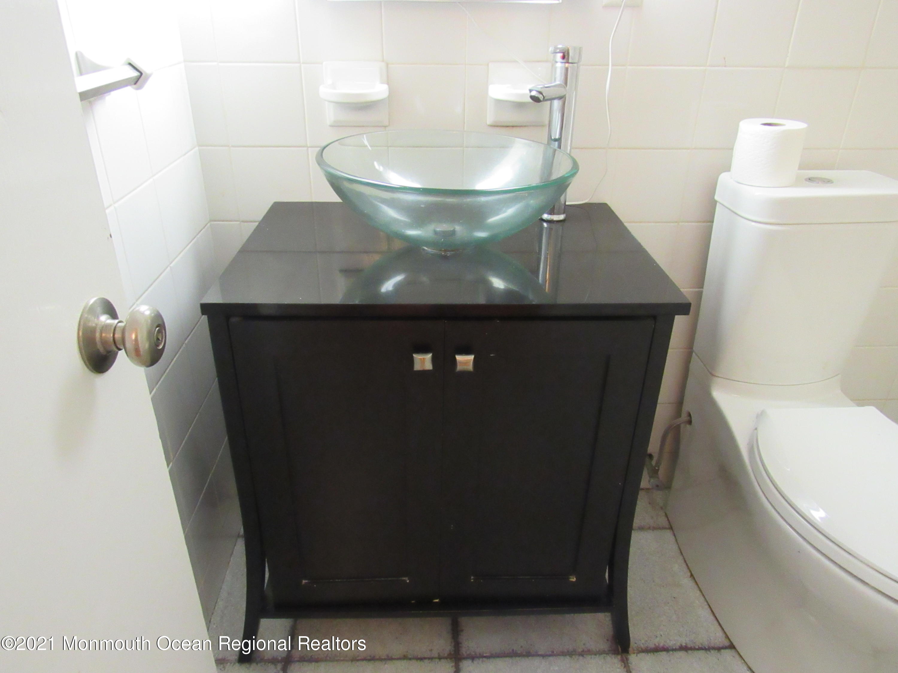 17 Pine Drive Roosevelt, NJ 08555 - Photo 15 of 22 a bathroom with a sink and a toilet