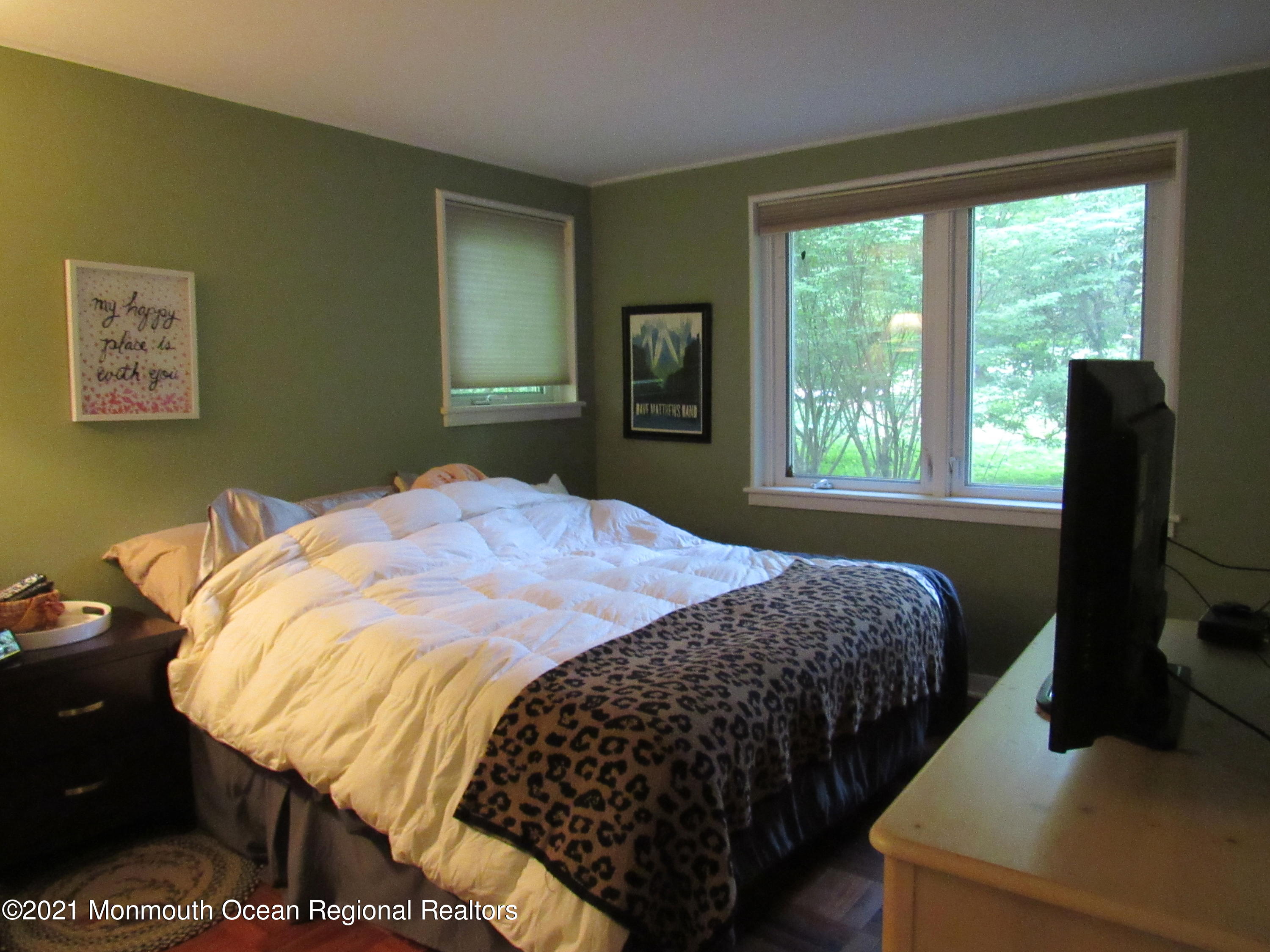 17 Pine Drive Roosevelt, NJ 08555 - Photo 17 of 22 a bedroom with a bed and wooden floor