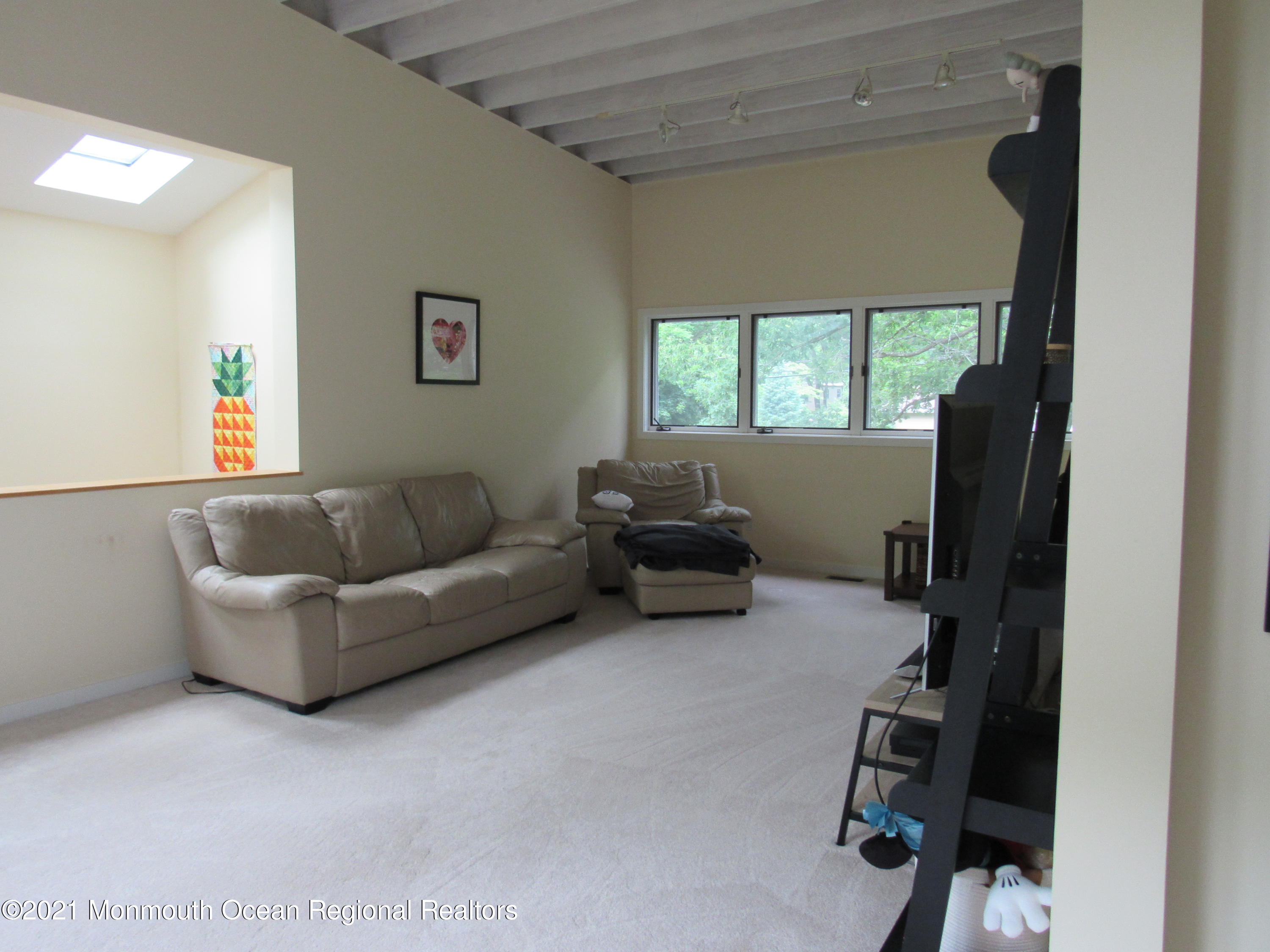 17 Pine Drive Roosevelt, NJ 08555 - Photo 20 of 22 a living room with furniture and a window