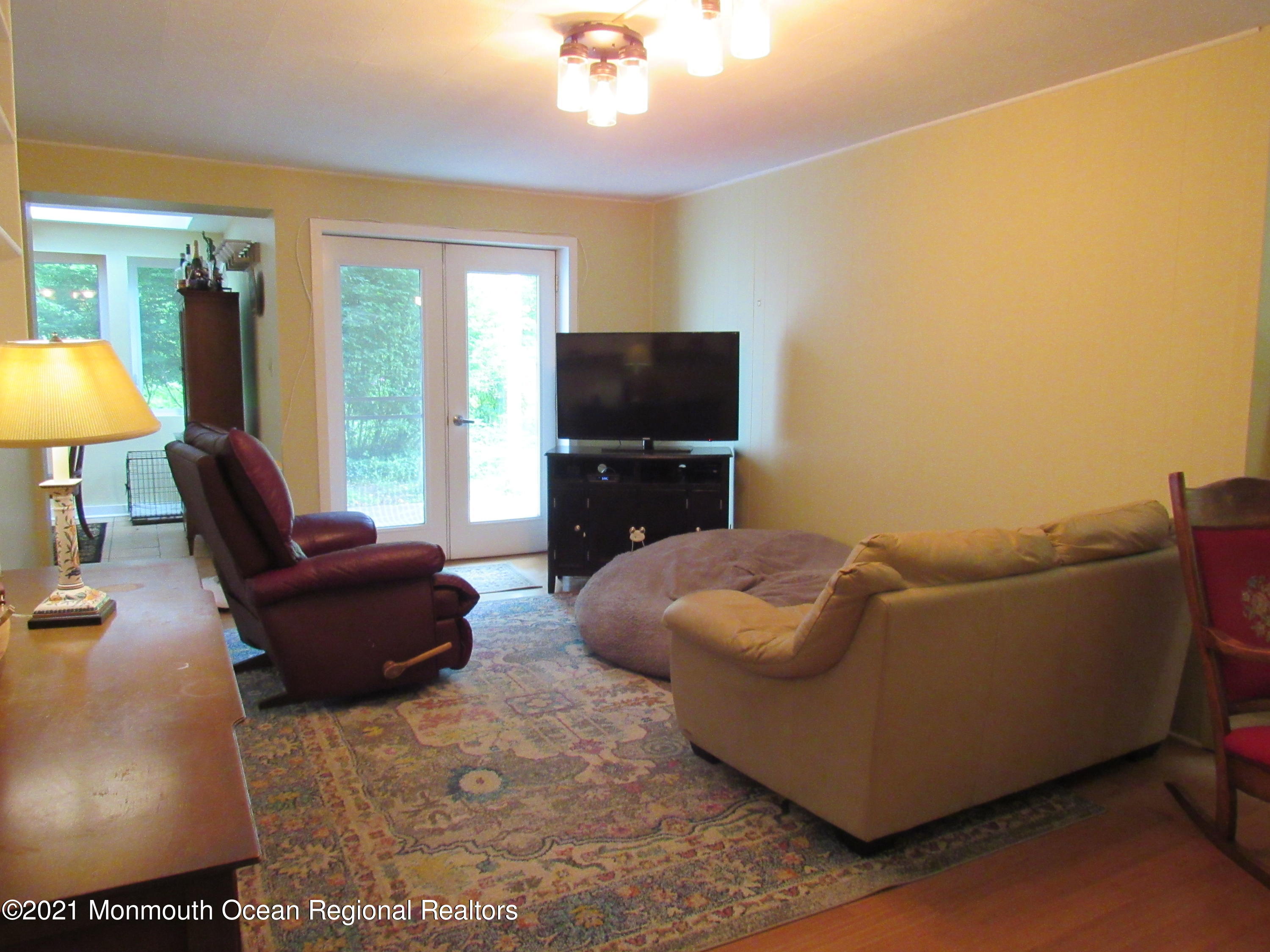 17 Pine Drive Roosevelt, NJ 08555 - Photo 9 of 22 a living room with furniture and a flat screen tv
