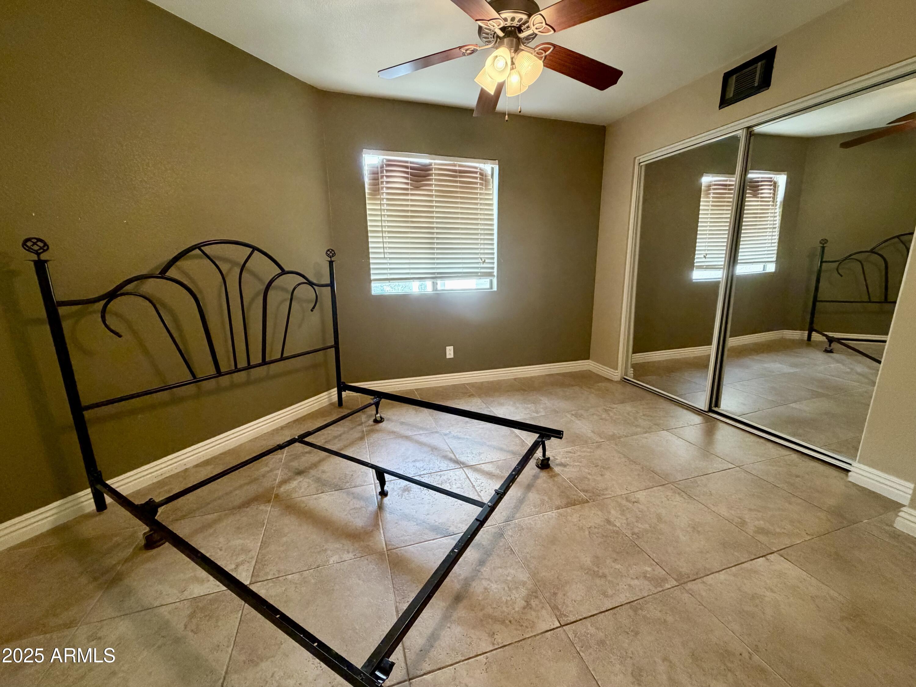 835 North Granite Reef Road, Unit 34 Scottsdale, AZ 85257 - Photo 11 of 13 a view of a livingroom with a furniture and windows