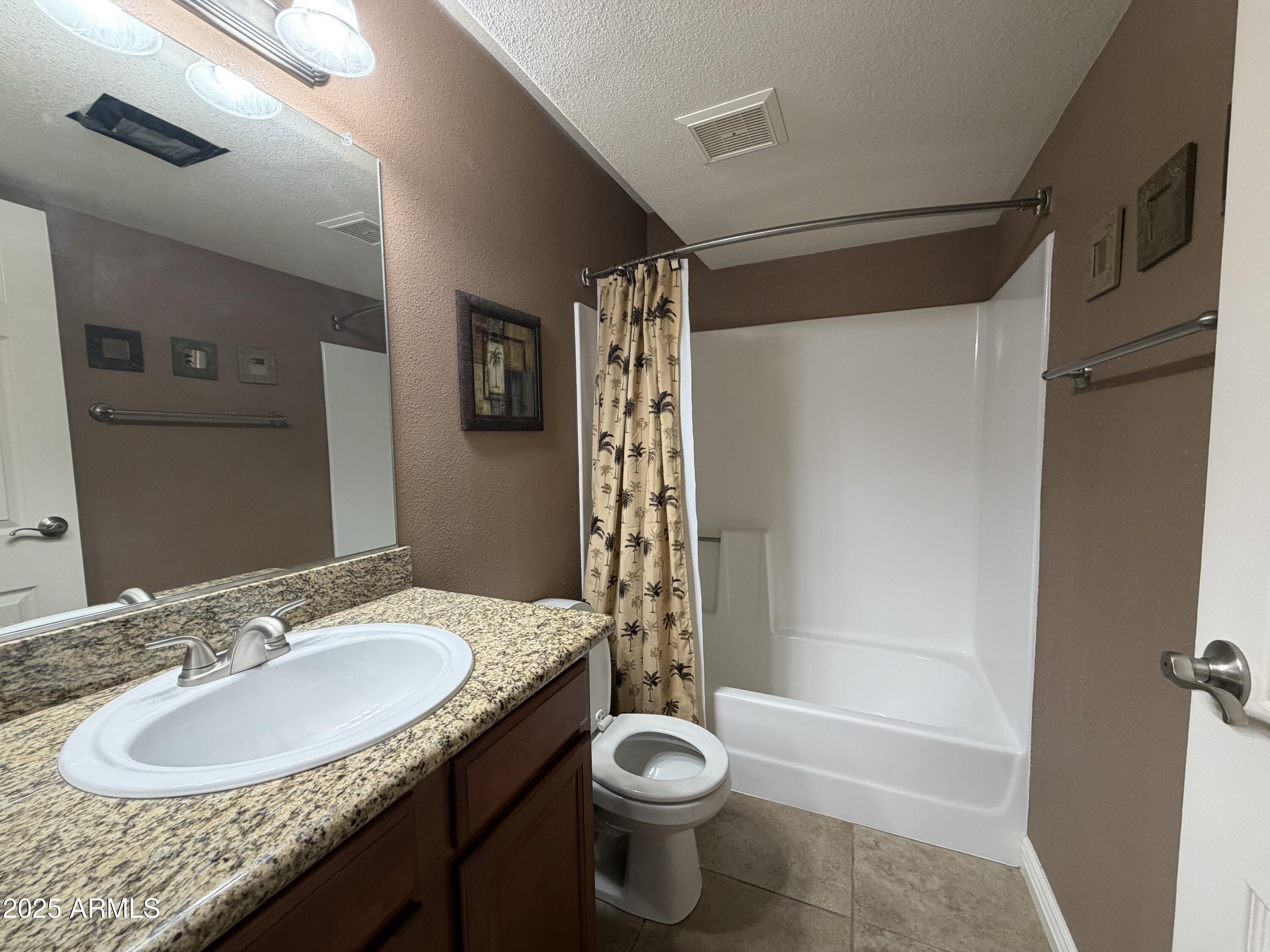 835 North Granite Reef Road, Unit 34 Scottsdale, AZ 85257 - Photo 7 of 13 a bathroom with a sink a toilet and shower