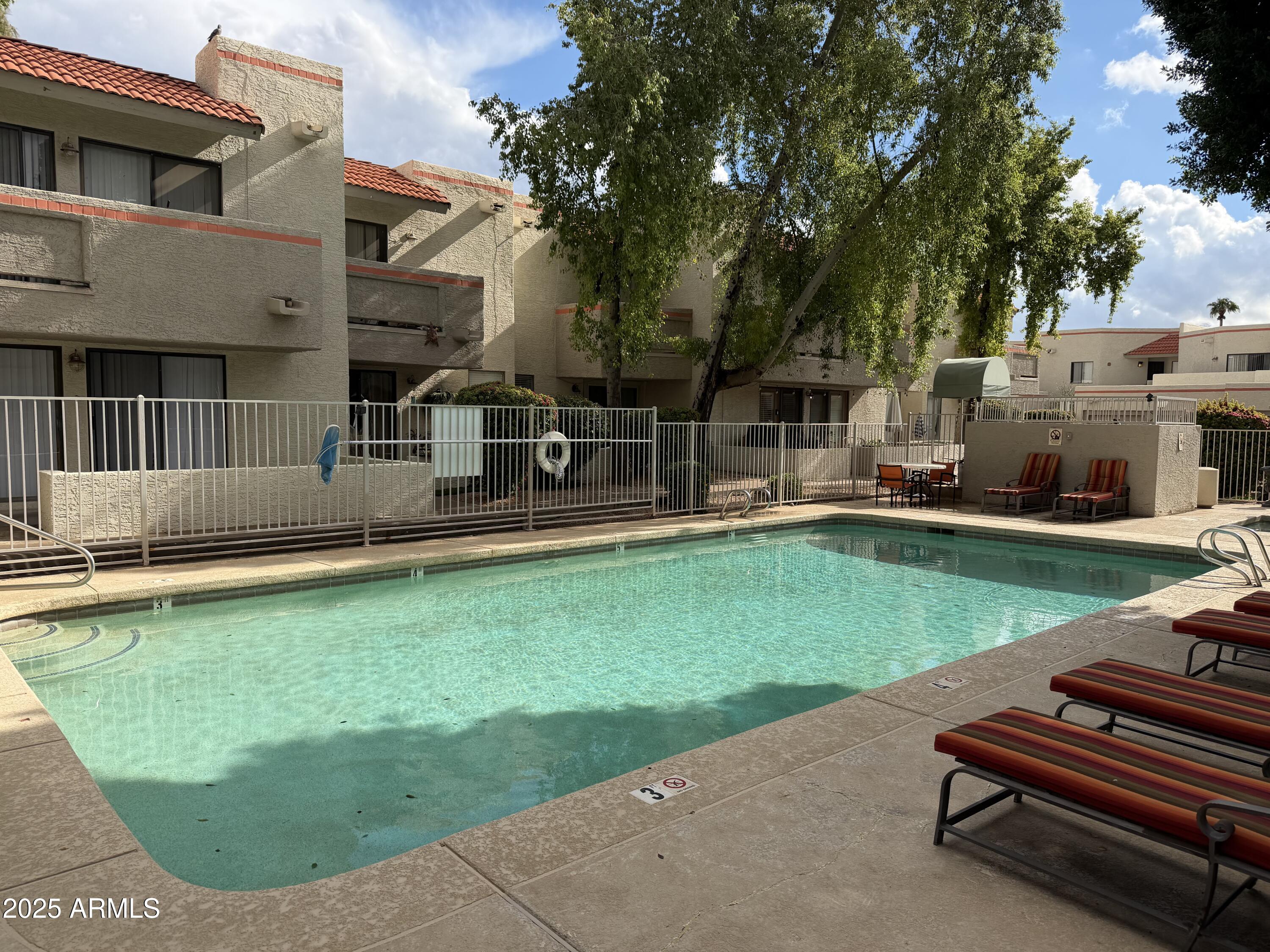 835 North Granite Reef Road, Unit 34 Scottsdale, AZ 85257 - Photo 9 of 13 a view of a house with a backyard