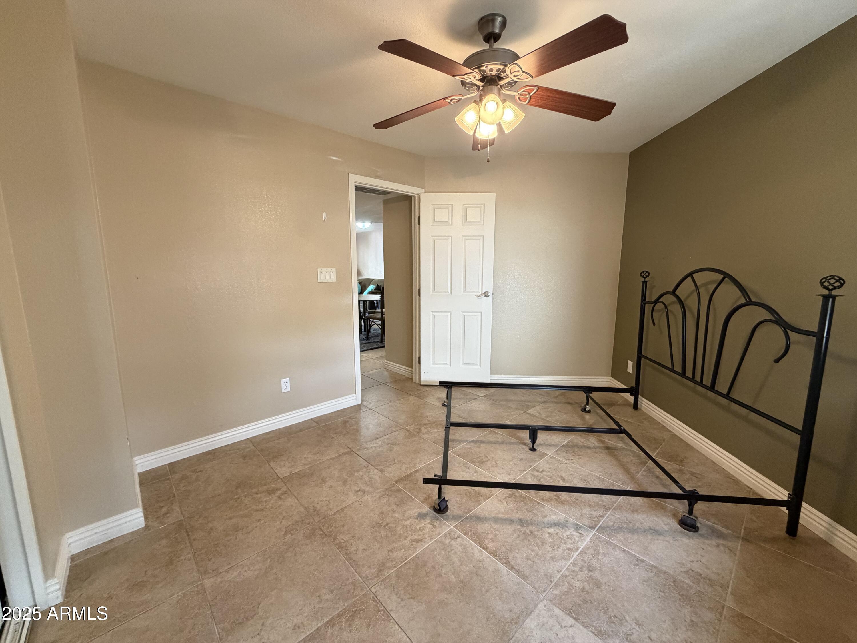 835 North Granite Reef Road, Unit 34 Scottsdale, AZ 85257 - Photo 10 of 13 a view of an empty room with a fan