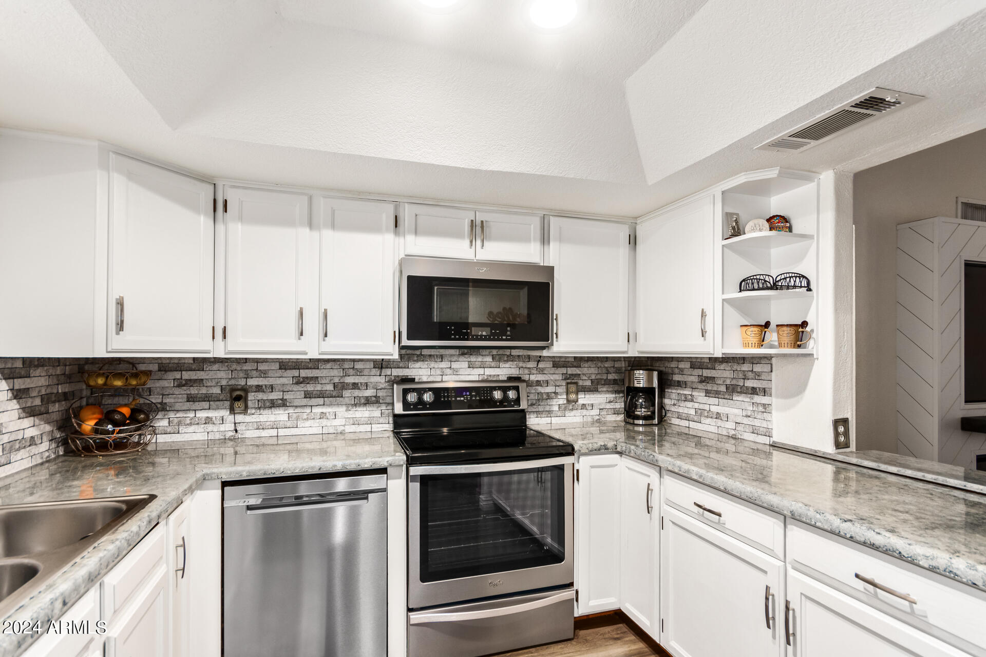 328 East Harwell Road Gilbert, AZ 85234 - Photo 15 of 33 a kitchen with granite countertop a sink and steel appliances