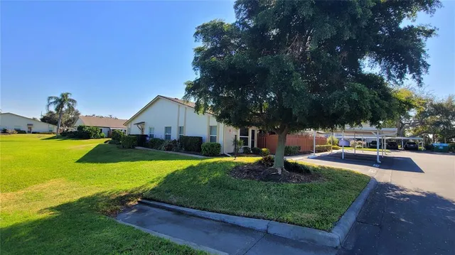 a swimming pool view with a outdoor seating