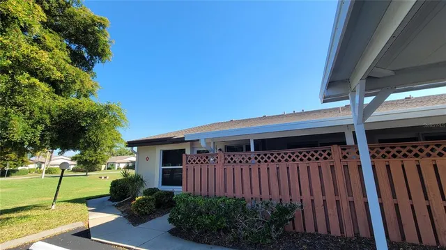 a view of a park with large trees