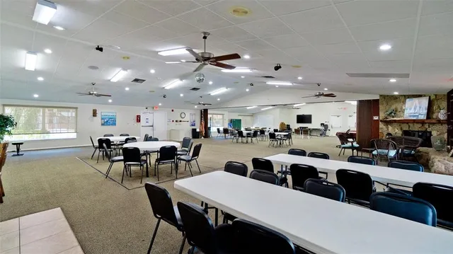 a kitchen with stainless steel appliances granite countertop a refrigerator a sink dishwasher a stove with wooden cabinets