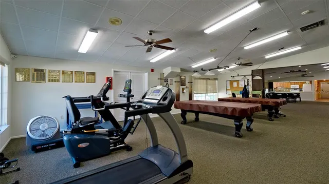 a dining room with furniture and a book shelf